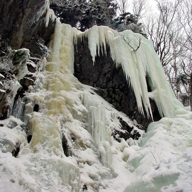 Ice climbing instruction and guiding in Grafton Notch State Park, Maine.