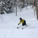 Skiing powder in Japan with Synnott Mountain Guides.