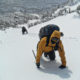 Climbing a snow gully in Tuckerman Ravine while heading towards the summit of Mount Washington, New Hampshire.