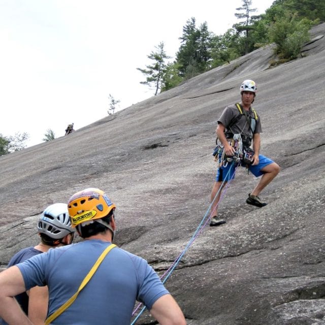 Mark Synnott teaching lead rock climbing. Standard Route on Whitehorse Ledge, New Hampshire.